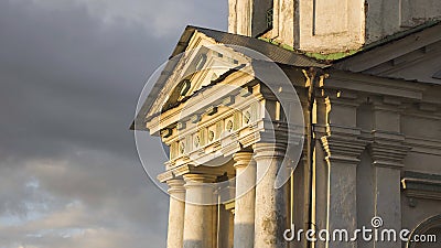 Pediment above columns of old building. Stock footage. Beautiful facade of ancient building with columns in sunlight on Stock Photo