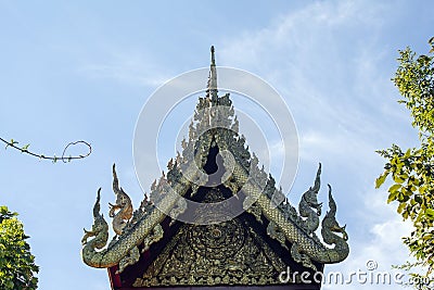 Pediment above hall at Wat Phra Kaew, Chiang Rai, Thailand Stock Photo