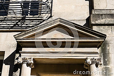 The pediment of a doorway on Brock Street, Bath with engaged Ionic columns Stock Photo