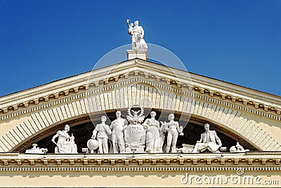 Pediment with sculptures of people from Stalin's empire Editorial Stock Photo