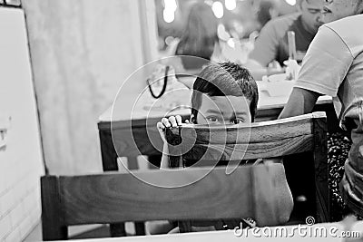 Peeking Kid in a candid moment Editorial Stock Photo