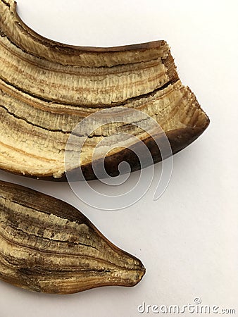 The peel of a ripe large banana on a white background. Macro. Stock Photo