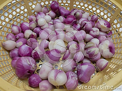 Peel shallots on basket , shallot background texture Stock Photo