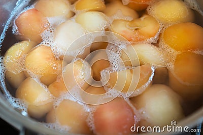 Peeled boiled apples in a sugar syrup Stock Photo