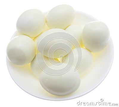 Peeled boiled eggs in a plate on a white background Stock Photo