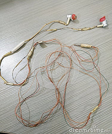 Peeled earphone wire but still works Stock Photo