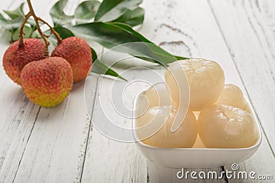 Peeled lichee in front with some fresh unpeel ones Stock Photo