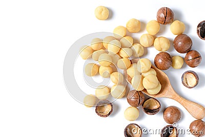 Peeled macadamia nuts in wood spoon isolated on white background Stock Photo