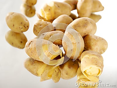 Peeled potatoes Stock Photo