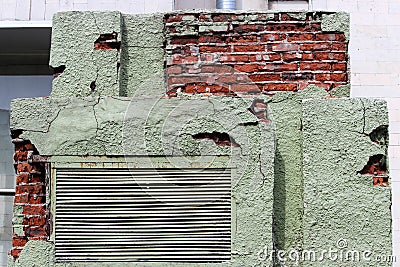 Peeling green plaster on a brick transformer box. background for the image of devastation and mismanagement. Russia Stock Photo