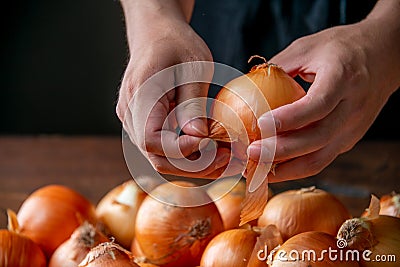 Peeling an onion. Stock Photo