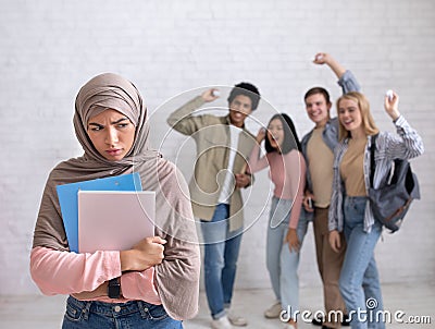 Peer problems, victim, racism, humiliation and bullying in college, school or university Stock Photo