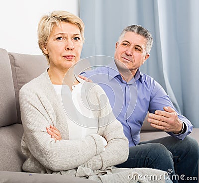 peeved mature couple quarreling at home with each other Stock Photo