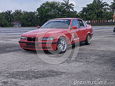 Pekanbaru, Indonesia - 05-28-2023: BMW E36 in Red, getting ready for Drive racing. BMW E36 on the parking lot. Editorial photo. Editorial Stock Photo