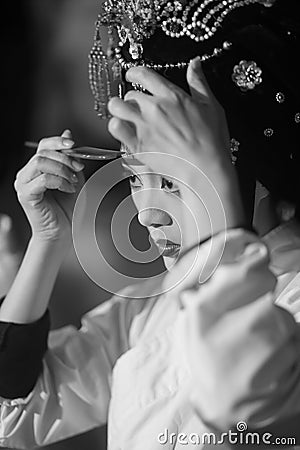 Peking opera actress makeup and comb hair Editorial Stock Photo