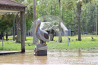 Pelican Wood Art On A River Bend. Editorial Stock Photo