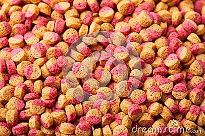 Pelleted compound fish feed background, wheatfeed pellets. Stock Photo