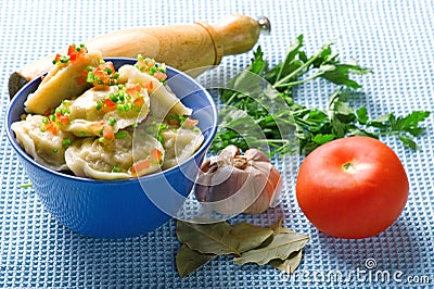 Pelmeni and garlic and bay leaf Stock Photo