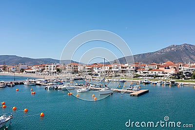 Peloponnese Paralio Astros port, Arcadia Greece. Aerial drone view of town, moored boat, buoy in sea Editorial Stock Photo