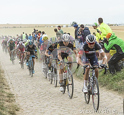 The Peloton on a Cobblestones Road - Tour de France 2015 Editorial Stock Photo