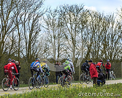 The Peloton on a Dirty Road - Paris-Nice 2016 Editorial Stock Photo