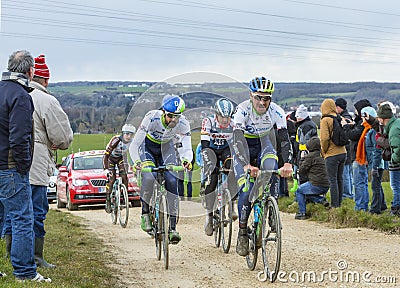 The Peloton on a Dirty Road - Paris-Nice 2016 Editorial Stock Photo