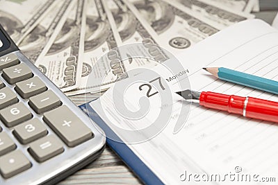 pen on the background of dollars, calculator. Stock Photo