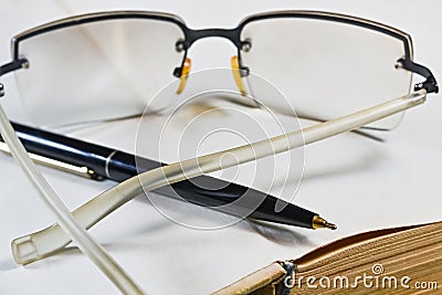 Pen book and glasses Stock Photo