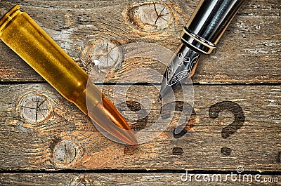 Pen and bullet Stock Photo