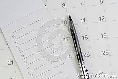 Pen on checklist with checkbox notepad on clean calendar using as special event, planner, important reminder or appointment list Stock Photo