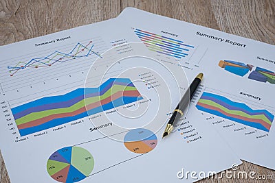 Pen graphs and calculators placed on the table. Concepts Data documents Graphs Graphs Marketing reports Research Development Stock Photo