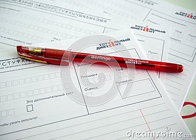 Pen and letterheads with the logo `Total dictation` Editorial Stock Photo