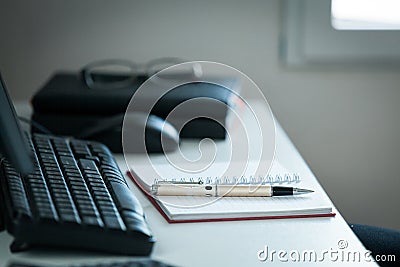 Pen with note on creative office desk Stock Photo