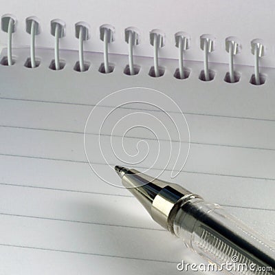 Pen on note pad Stock Photo