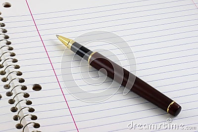 Pen on lined notebook Stock Photo