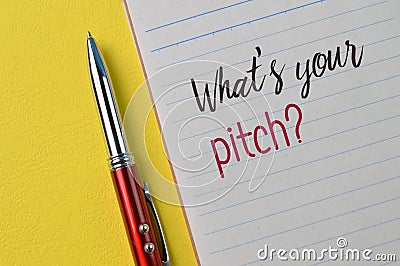 Pen and notebook with question WHAT`S YOUR PITCH Stock Photo