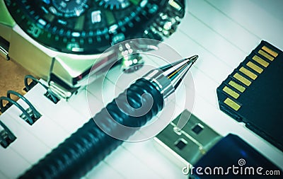 Pen, notepad, memory stick, memory card and men`s watch on table Stock Photo