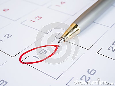 Pen put on calendar desk Stock Photo