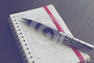 Pen on schedule Stock Photo