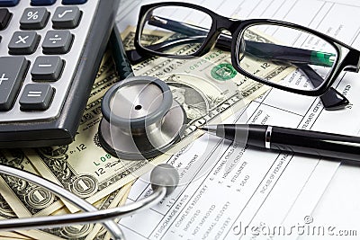 Pen stethoscope glasses and dollar Stock Photo