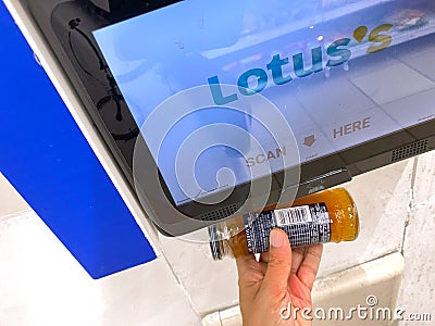 Penang, Malaysia - April 08, 2021 : Close up view of a mounted bar code price checker inside a Lotus`s store at Udini Square Editorial Stock Photo
