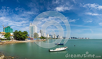 Penang Malaysia Georgetown. City panorama at the sea coast promenade hotel and fishing boat view Editorial Stock Photo