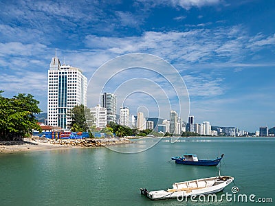 Penang Malaysia Georgetown. City panorama at the sea coast promenade hotel and fishing boat view Editorial Stock Photo