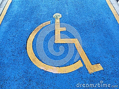 Parking for the disabled. The parking lot has a blue background and has a special logo. Editorial Stock Photo