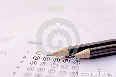 Pencil on answer sheets or Standardized test form with answers bubbled. multiple choice answer sheet Stock Photo