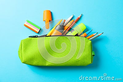 Pencil case with school supplies on blue background Stock Photo