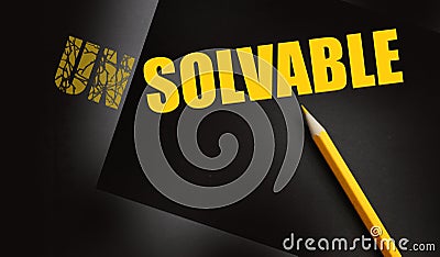 Pencil changing the word Unsolvable into Solvable yellow on black. Business and career solutions concept Stock Photo