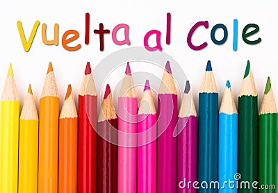Pencil Crayons with text Vuelta al Cole - Back to School in Span Stock Photo