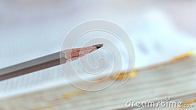 Pencil on open book background, marking while reading Stock Photo
