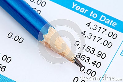 Pencil and wage slip Stock Photo